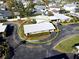 Aerial view of single-story home with carport, situated in a residential neighborhood at 500 Park S Blvd # 7, Venice, FL 34285