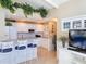 White kitchen with granite countertops and breakfast bar at 500 Park S Blvd # 7, Venice, FL 34285