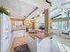 Open kitchen with breakfast bar and view into living room at 500 Park S Blvd # 7, Venice, FL 34285