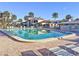 Inviting community pool with plenty of lounge chairs at 500 Park S Blvd # 7, Venice, FL 34285