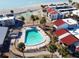 Community pool with lounge chairs, offering a relaxing space at 500 Park S Blvd # 7, Venice, FL 34285