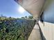 Sidewalk leading to the home with lush hedges at 500 Park S Blvd # 7, Venice, FL 34285