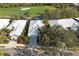 Aerial view of a well maintained single-Gathering home near a golf course and mature landscaping at 522 Fallbrook Dr, Venice, FL 34292