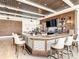 Full bar with light colored barstools and tvs at the Venice Golf and Country Club at 522 Fallbrook Dr, Venice, FL 34292