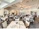 Elegant dining room with tables set at the Venice Golf and Country Club at 522 Fallbrook Dr, Venice, FL 34292