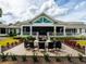Outdoor fire pit with seating and beautiful landscaping at the Venice Golf and Country Club at 522 Fallbrook Dr, Venice, FL 34292