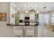 Beautiful, well-lit kitchen with pendant lights, modern appliances and a breakfast bar with barstool seating at 522 Fallbrook Dr, Venice, FL 34292