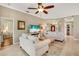 Bright living room with neutral decor, tile floors, and an open layout at 522 Fallbrook Dr, Venice, FL 34292