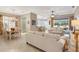 Open-concept living area with a dining area and view of the backyard at 522 Fallbrook Dr, Venice, FL 34292