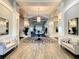 Interior shot of a large, decorated lobby at Venice Golf and Country Club with seating at 522 Fallbrook Dr, Venice, FL 34292