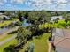 Beautiful aerial view showcasing the home's lush backyard landscaping with a private pool and stunning waterfront views at 523 Park Estates Sq, Venice, FL 34293