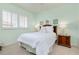 Charming bedroom with a queen bed, coastal decor, and ample natural light at 523 Park Estates Sq, Venice, FL 34293