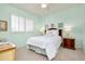 Charming bedroom with a queen bed, coastal decor, and ample natural light at 523 Park Estates Sq, Venice, FL 34293
