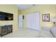 Comfortable sitting area with a TV, tile floor, and plenty of closet space at 523 Park Estates Sq, Venice, FL 34293