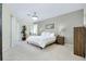 Spacious primary bedroom with plush carpet and an abundance of natural light at 523 Park Estates Sq, Venice, FL 34293