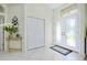 Bright foyer with tile flooring, double-door entry, and decorative accents at 523 Park Estates Sq, Venice, FL 34293
