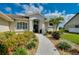 Inviting front entrance with landscaped walkway and double doors at 523 Park Estates Sq, Venice, FL 34293