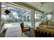 Relax in this covered lanai by the pool with comfortable seating and great views at 523 Park Estates Sq, Venice, FL 34293