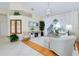 Living area with high ceilings, lots of natural light, and view of the lanai at 523 Park Estates Sq, Venice, FL 34293