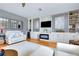 Stylish living room features custom built-ins, modern fireplace, and comfortable white seating at 523 Park Estates Sq, Venice, FL 34293