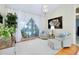 Bright living room featuring comfortable seating, elegant lighting, and a view of the pool area at 523 Park Estates Sq, Venice, FL 34293