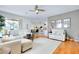 Bright and airy living room featuring an open floor plan and a view of the outdoor pool at 523 Park Estates Sq, Venice, FL 34293