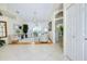 Living area with tile floors, bright lighting, and view to the lanai at 523 Park Estates Sq, Venice, FL 34293