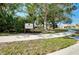 Willow Rest Park sign with green grass and mature trees providing shade at 523 Park Estates Sq, Venice, FL 34293