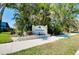 Entrance sign for the Park Estates community surrounded by lush landscaping at 523 Park Estates Sq, Venice, FL 34293