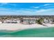 Aerial view of oceanfront building and coastal landscape at 550 W Flamingo # 401, Venice, FL 34285