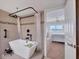 Modern bathroom with large soaking tub and access to bedroom at 550 W Flamingo # 401, Venice, FL 34285
