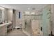 Elegant bathroom with a large walk-in shower and double vanity at 550 W Flamingo # 401, Venice, FL 34285