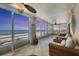 Serene lanai with sunset views and wicker furniture at 550 W Flamingo # 401, Venice, FL 34285