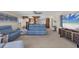 Spacious living room with comfy seating and a large TV at 550 W Flamingo # 401, Venice, FL 34285