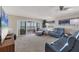 Relaxing living room with ocean views, comfy seating, and large TV at 550 W Flamingo # 401, Venice, FL 34285