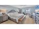 Main bedroom with king bed, ocean view, and dresser at 550 W Flamingo # 401, Venice, FL 34285