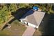 Aerial view of house with a driveway and pool at 5550 Eyerly Ter, Port Charlotte, FL 33981