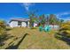 Backyard with pool, patio furniture, and grassy area at 5550 Eyerly Ter, Port Charlotte, FL 33981