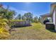 Partial view of backyard with above-ground pool at 5550 Eyerly Ter, Port Charlotte, FL 33981