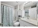 Clean bathroom with a tub, shower, and vanity at 5550 Eyerly Ter, Port Charlotte, FL 33981