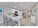 Modern kitchen with white cabinets, stainless steel appliances, and an island at 5550 Eyerly Ter, Port Charlotte, FL 33981