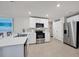 Modern kitchen with white cabinets, stainless steel appliances, and an island at 5550 Eyerly Ter, Port Charlotte, FL 33981