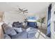 Spacious living room with gray sectional sofa and large TV at 5550 Eyerly Ter, Port Charlotte, FL 33981