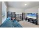 Relaxing media room with a large TV and ample shelving at 5550 Eyerly Ter, Port Charlotte, FL 33981
