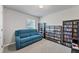 Comfortable media room with a couch and lots of media storage at 5550 Eyerly Ter, Port Charlotte, FL 33981