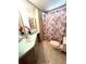 Bathroom with a toilet, sink and flamingo shower curtain at 563 Portside Dr, North Port, FL 34287