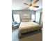 Spacious bedroom with a king-size bed and an armchair at 563 Portside Dr, North Port, FL 34287