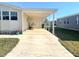 Covered carport with access to mobile home at 563 Portside Dr, North Port, FL 34287