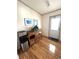 Bright entryway with water cooler, storage, and wood floors at 563 Portside Dr, North Port, FL 34287