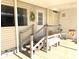 Front entry with steps, bench and decorative accents at 563 Portside Dr, North Port, FL 34287
